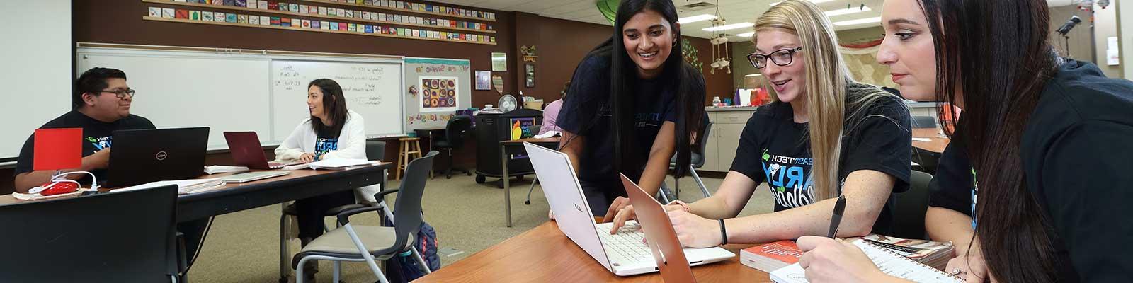 Group of students working in early childhood classroom and lab